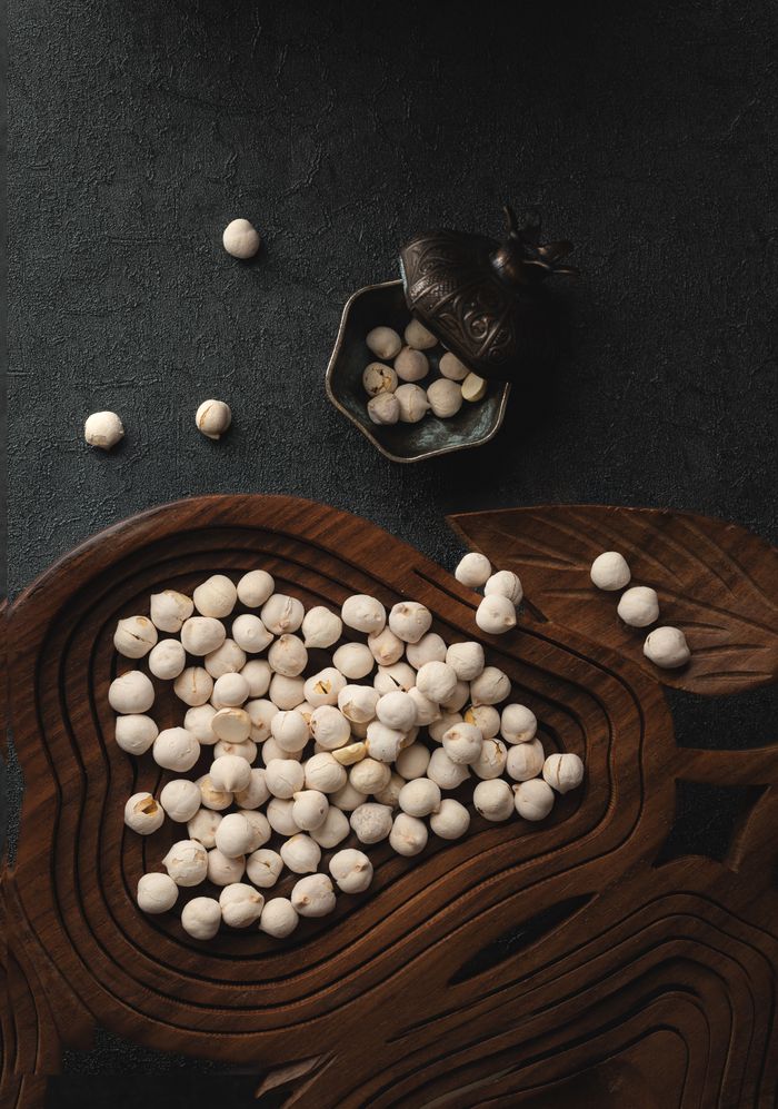 The Art of Drawing Readers In: Your attractive post title goes here A flat lay of roasted chickpeas in a decorative wooden bowl, embodying Turkish cuisine.